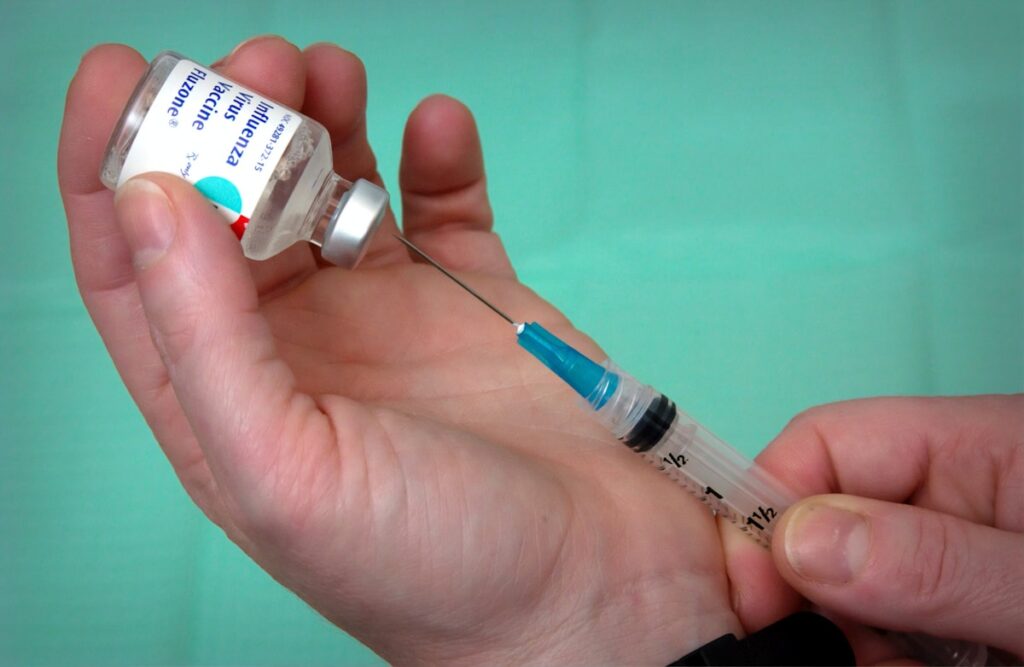 Vaccine vial and syringe